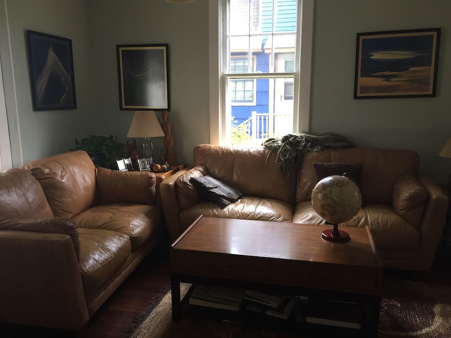 Comfortable leather couches and chairs make up living room