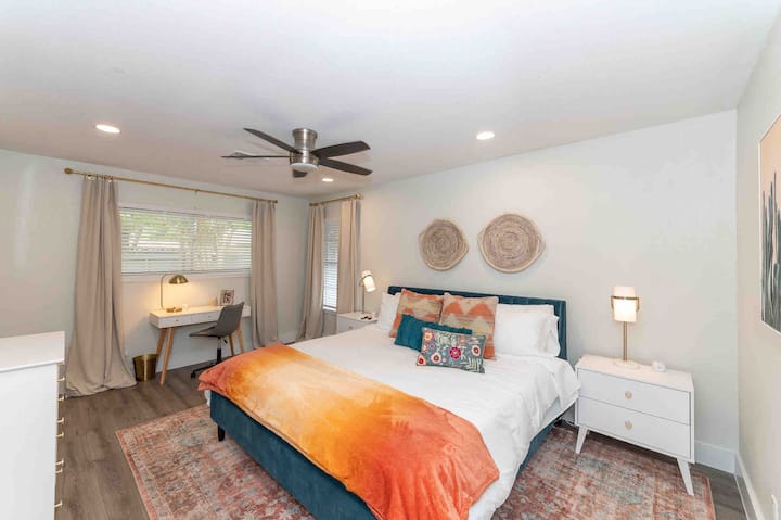 Gorgeous master bedroom with king size bed, lovely personal touches and plush bedding. 