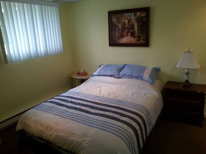 First bedroom with queen size bed .