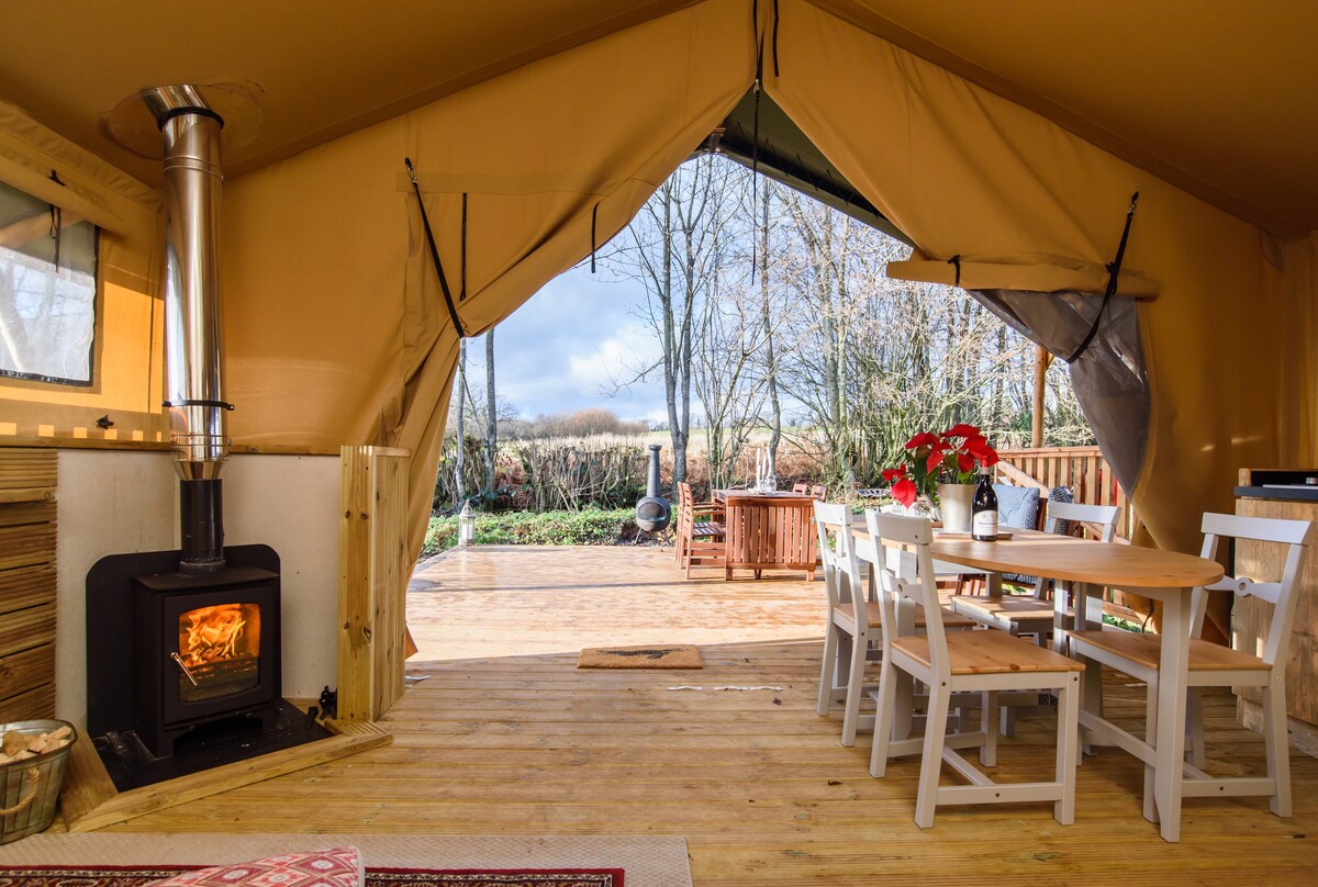 Tents with outlet log burners