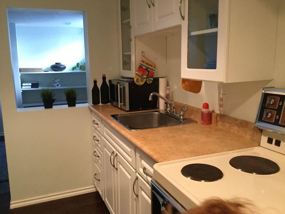 Kitchen looks on to the den