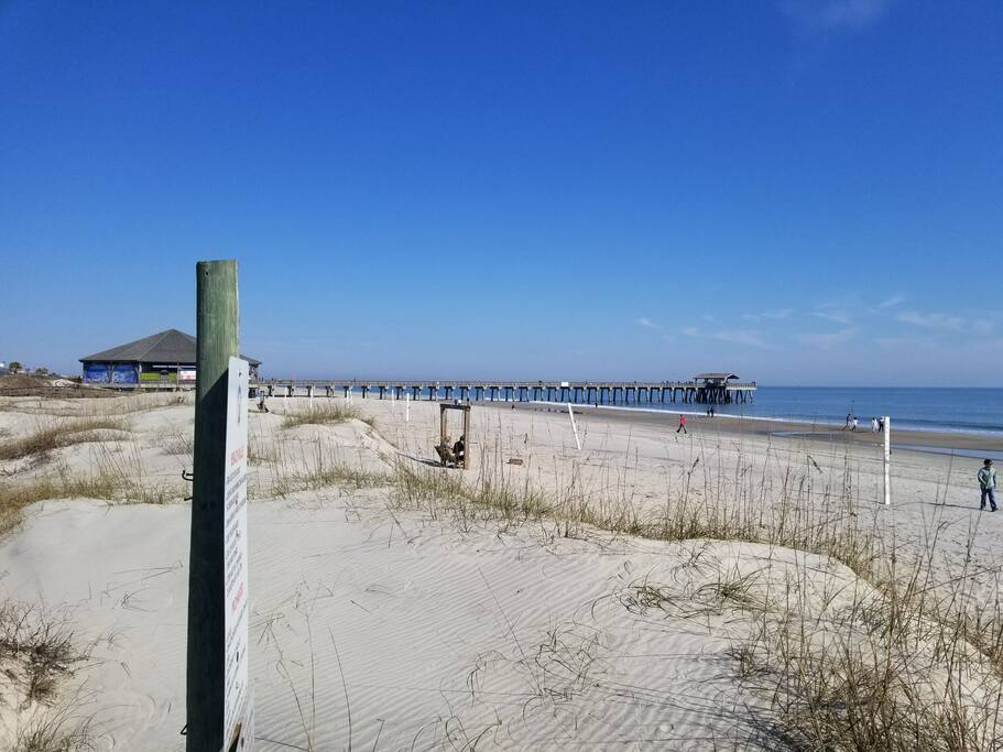 the beach at the end of our street is beside the pier