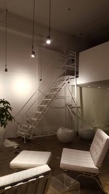 ROLLING INDUSTRIAL LADDER LEADS TO LOFT