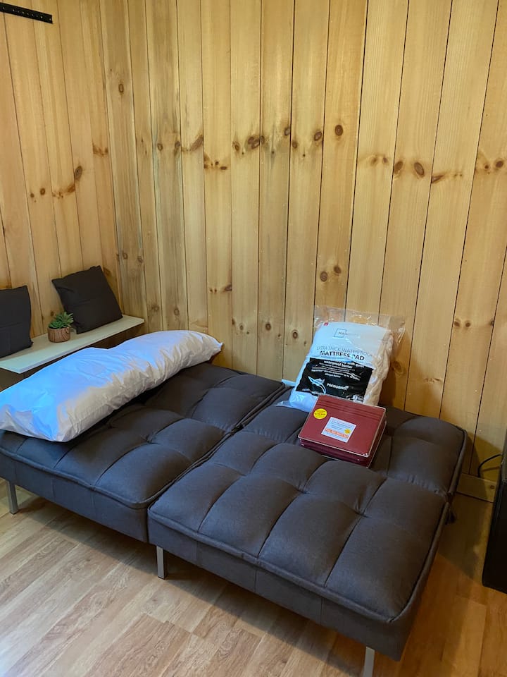 There is an additional memory foam futon mattress for added comfort.
Mattress pad and sheets for the futon are stored in the ottoman in the same room.
**Always use the mattress pad over the mattress and futon.**
Pillows are in the  bedroom closet. 