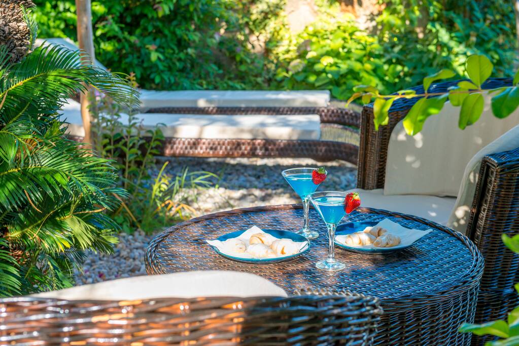 Guests can relax hidden among shades of mediterranean garden equipped with lounge furniture boosting spectacular sea view over Adriatic Sea, Lokrum Island and UNESCO protected Dubrovnik Old Town