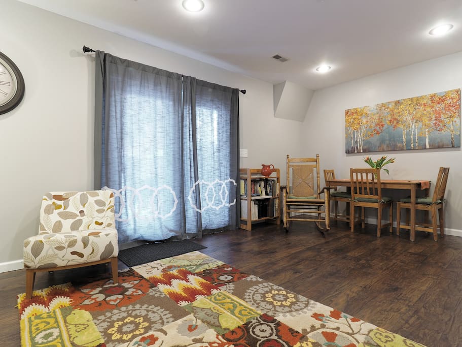 Living room boasts bright French doors opening onto the private deck and yard.