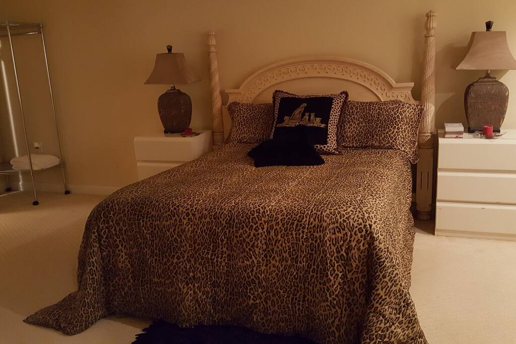Master bedroom leads to full bath with whirlpool tub.