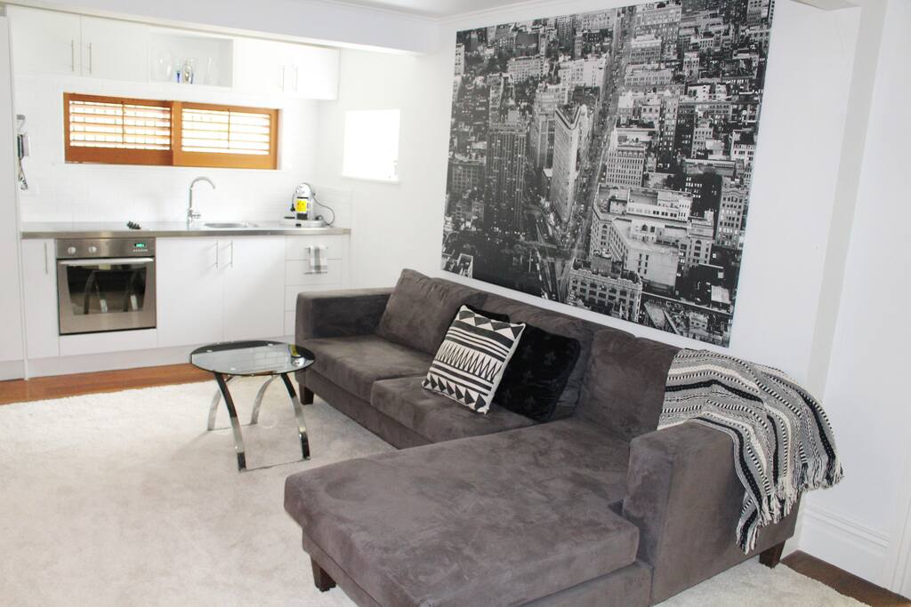 Comfortable sectional sofa, contemporary black and white artwork