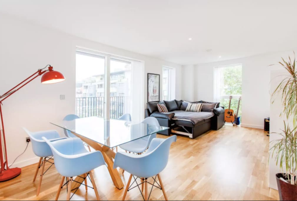 Large, bright living room. 55" TV, Piano and super comfy sofa.