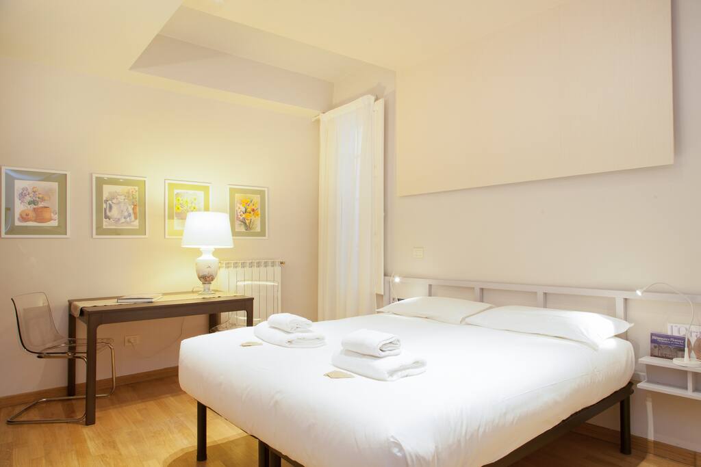 The Living room - The comfortable double bed with soft bed-linen and towels