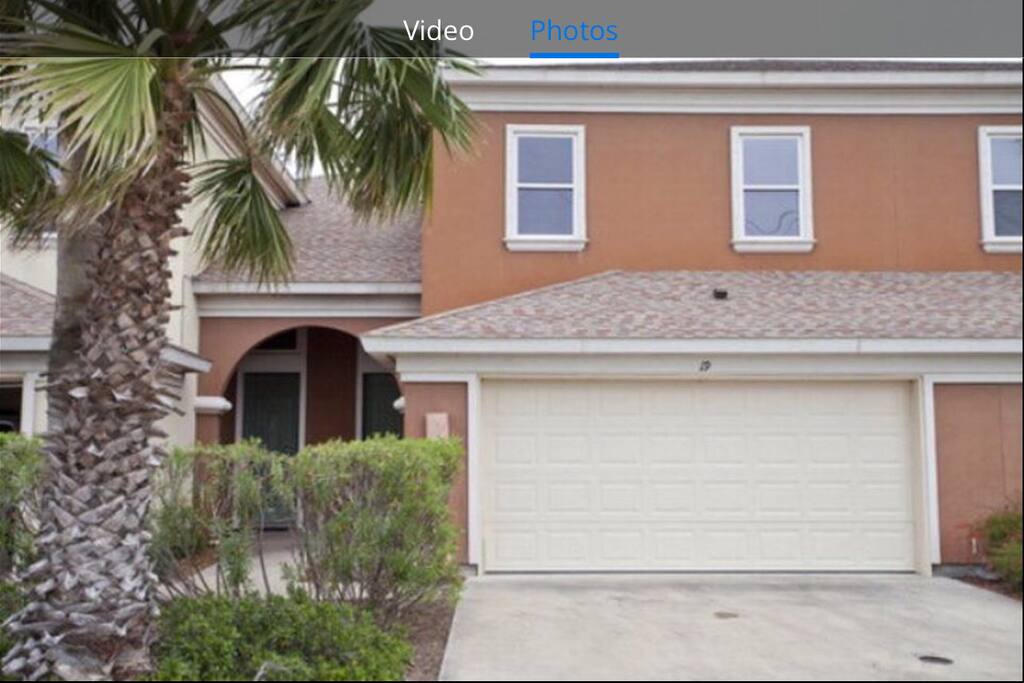 Front of our home, with an attached garage leading into the laundry room.