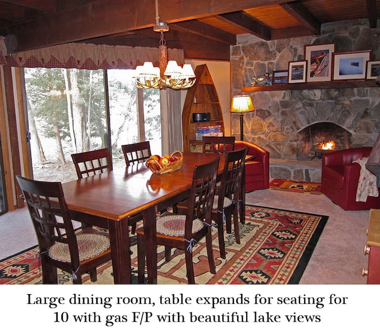 Dining room with stone fireplace
