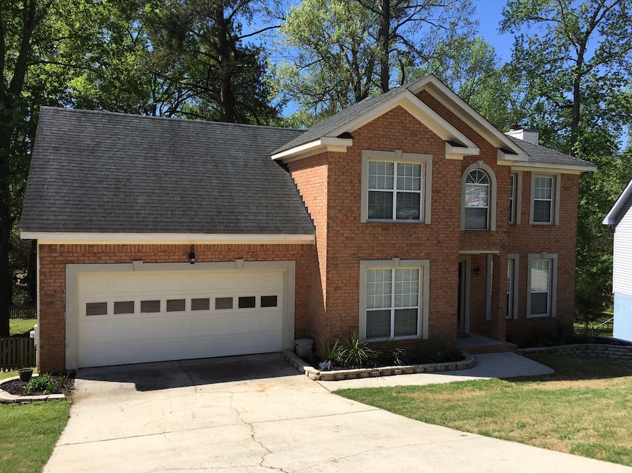 Our home is located on a small downward incline. Feel free to park on the street, in the driveway or in the garage with straight access inside the home. The garage is able to fit two average size cars.