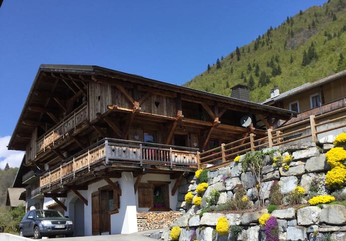 A separate bedroom with a shower and a restroom