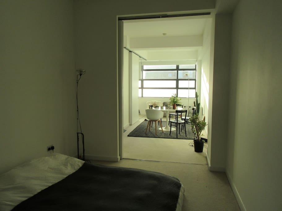 Open plan living and sleeping areas separated by sliding doors