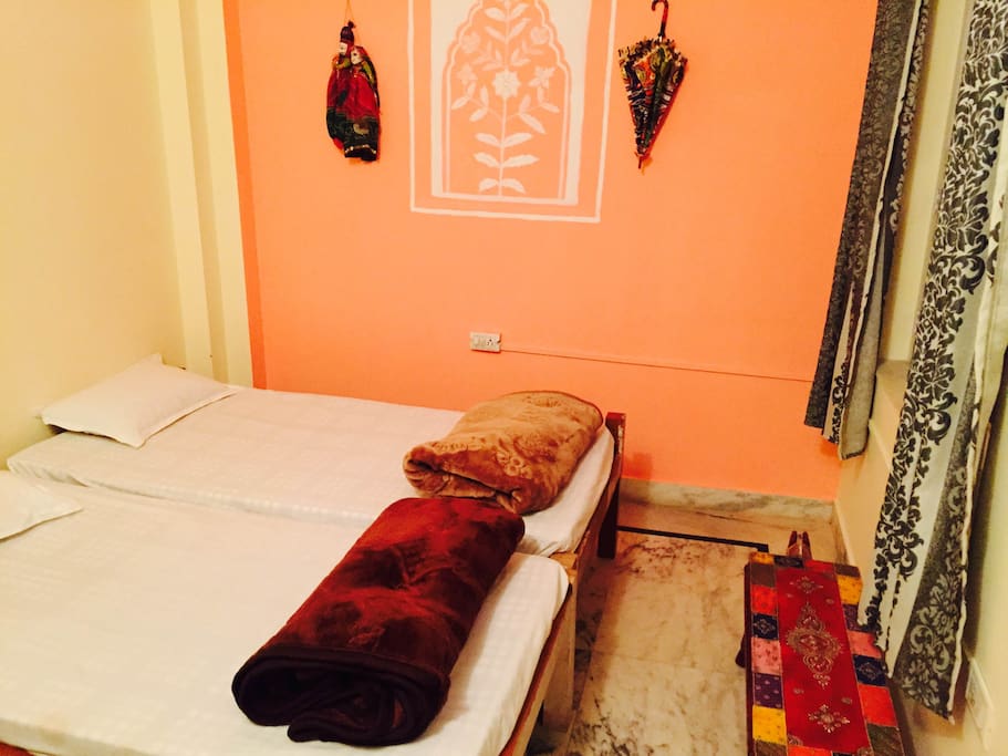 A beautifully decorated Twin private with rajasthani furniture and daily cleaning and ensuite washroom