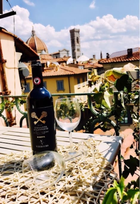 ENJJOYNG A GLASS OF WINE IN THE AMAZING TERRACE