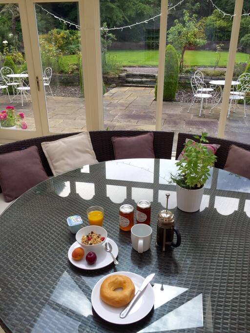 Breakfast can be eaten in our Orangerie in the summer - great garden views
