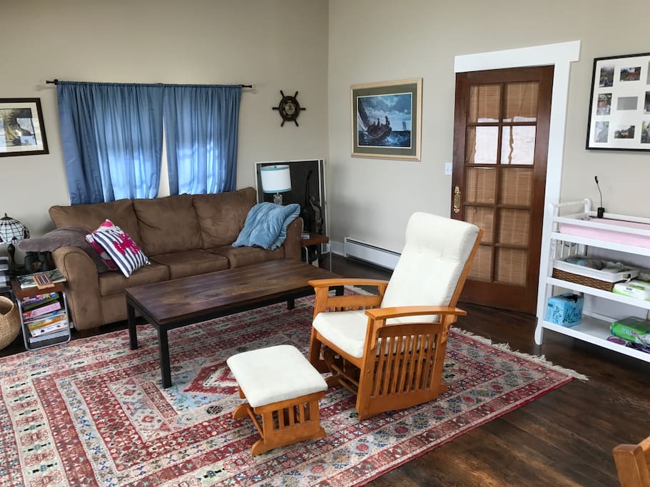 Living room that includes couch with a hide-a-bed