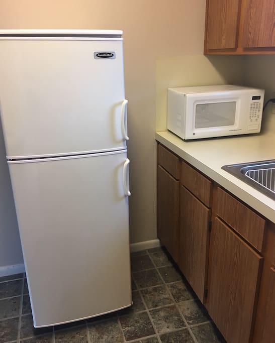 Full Kitchen with Electric Stove & Oven, Full Frig and Microwave.