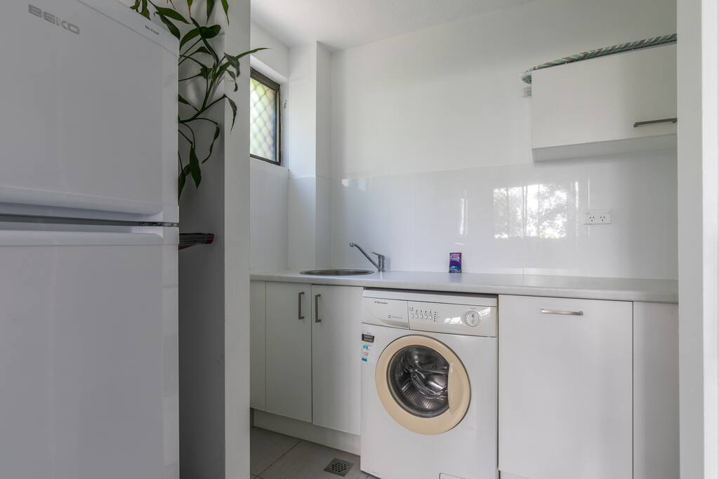 This is the utility room with washing machine, under mount sink etc. Equipped with ironing board, iron, washing powder etc.