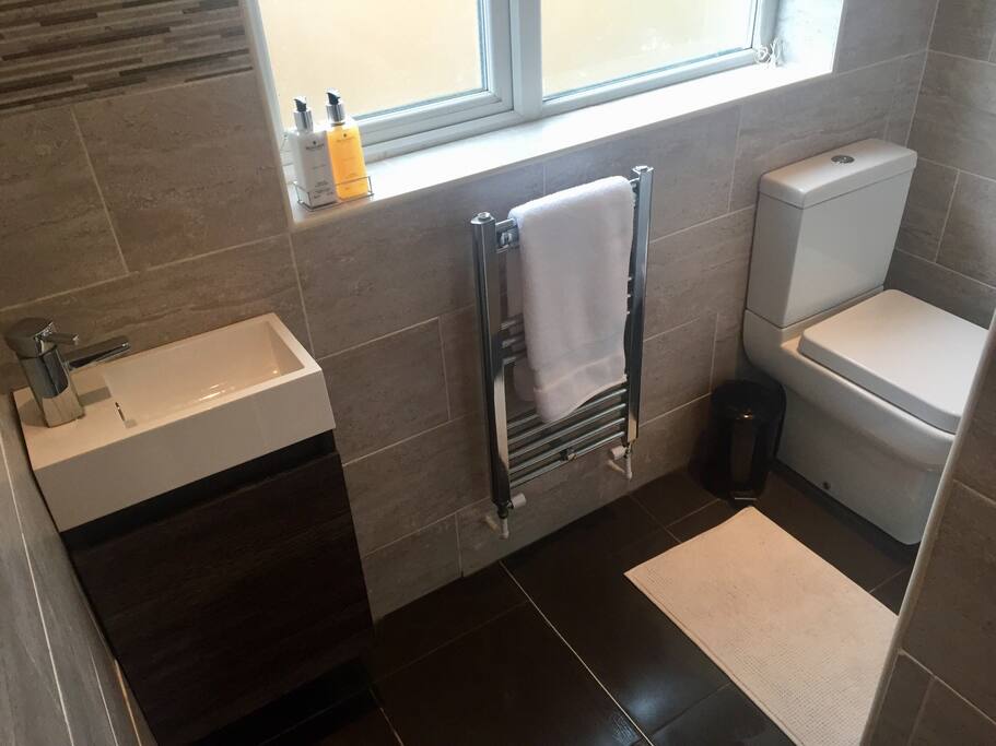 Private bathroom with underfloor heating and heated towel rail