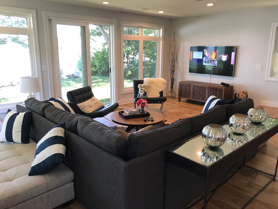 Comfortably sit 8+ in the nautical inspired living room