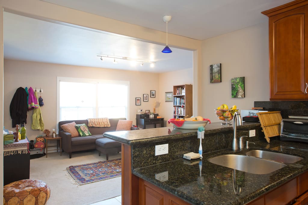 The kitchen looks out over the living room.