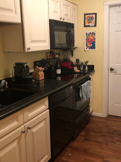Small but functional kitchen with high end appliances and espresso maker