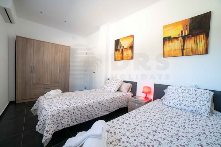 Bedroom 1 with two single beds