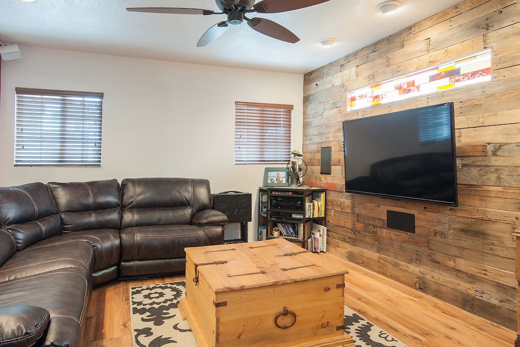 Reclaimed wood wall featuring 60 inch TV and surround sound