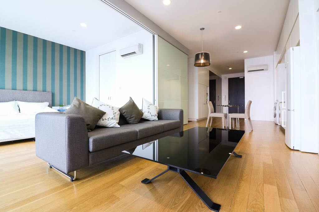 Spacious bedroom linked to the living area