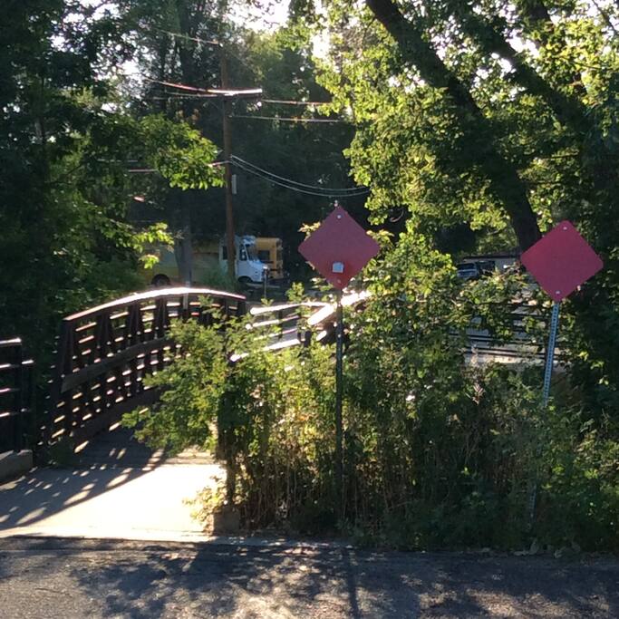 Walking bridge over the creek.
The gravel drive is to your right.
