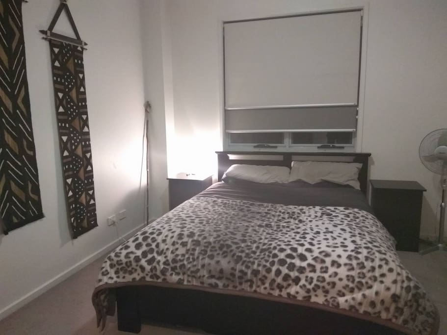 Queen bed with walk-in robe and en suite