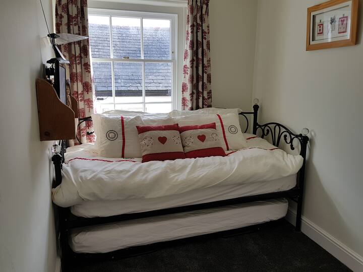 Trundle in second bedroom, set out as a daybed/single bed.