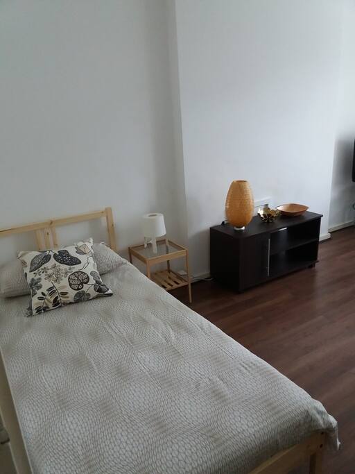 Single bed in living room