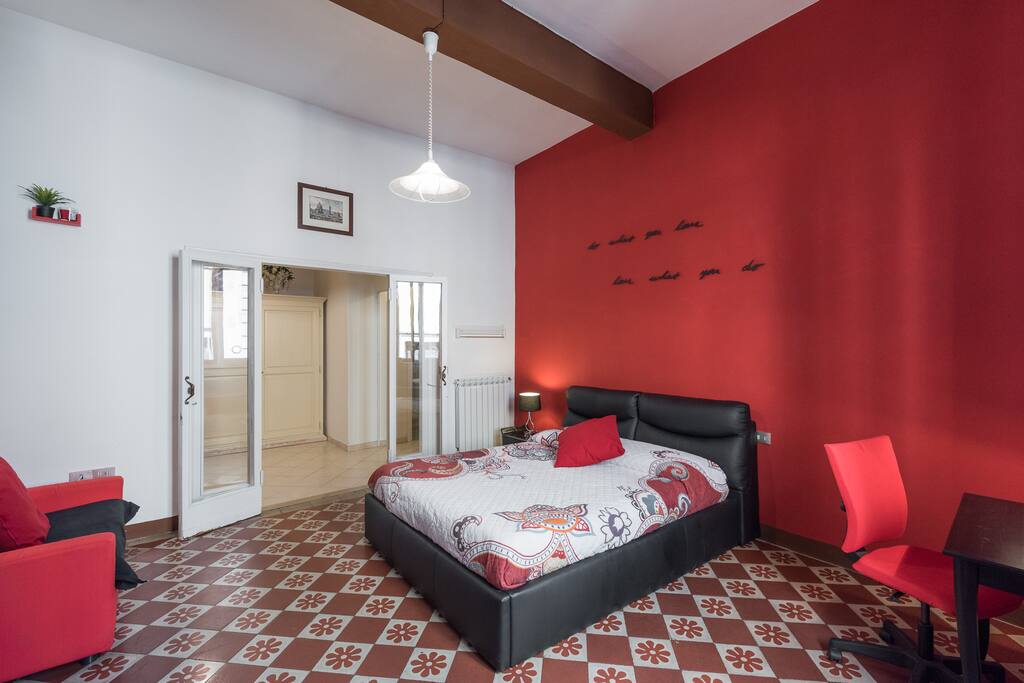 bedroom with king size bed and a single couch bed