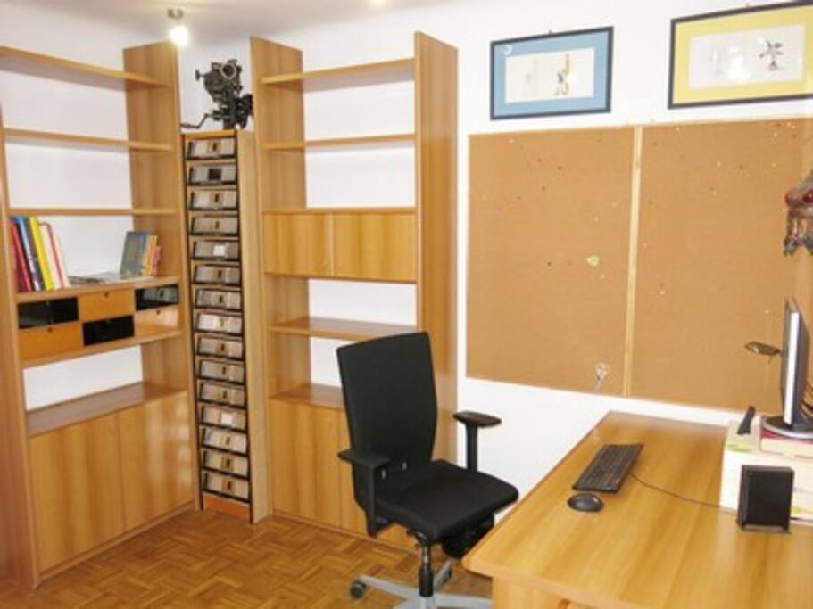 Large office table with ergonomic office chair.