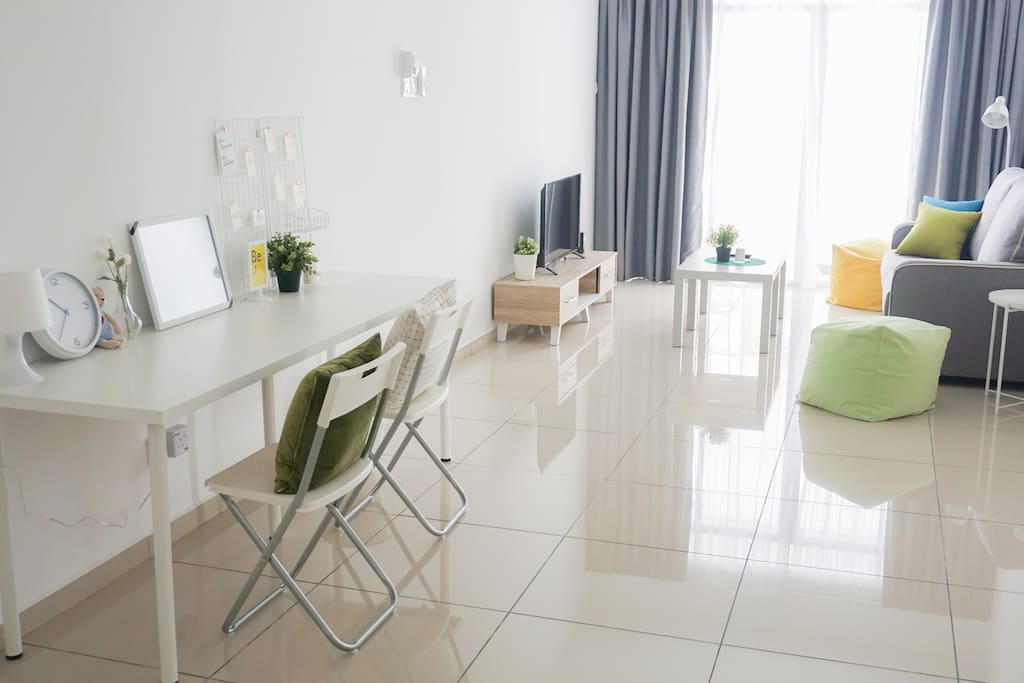 Living Room with Couch, Bean Bags, Coffee Table, Side Table, TV set and Work Space