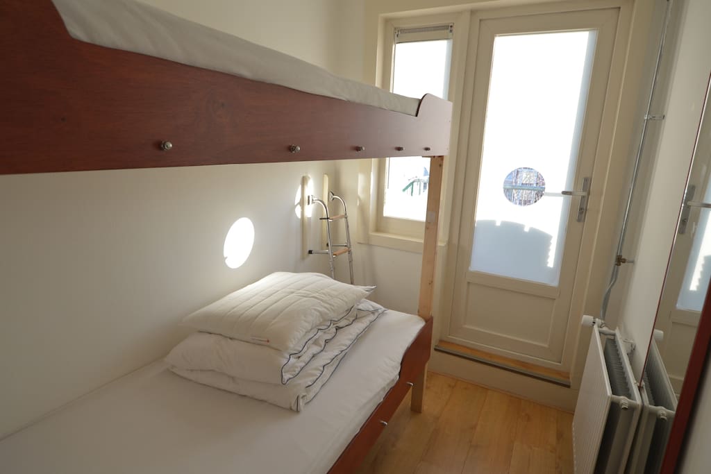 Nautical bunks. Two on second floor, two on upper floor. If you are afraid to sleep in the upper bed, just ask yourself "how often in my life did I fall out of my bed"....