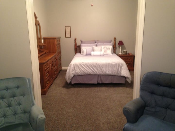 When you walk in door from the outside, go to left for this bedroom.