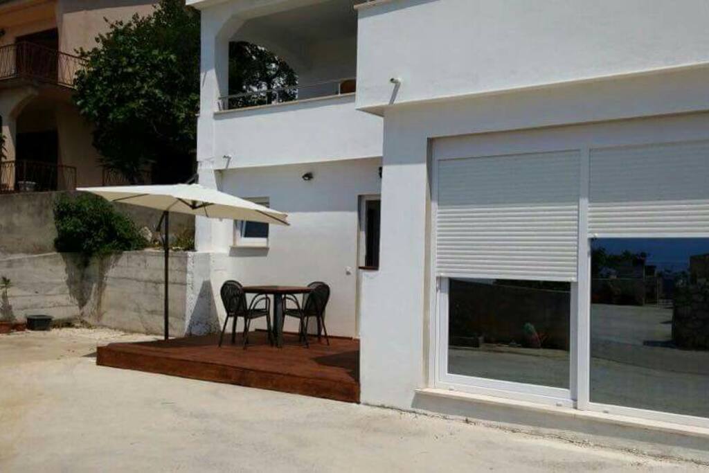 Studio apartment terrace and sliding living room door
