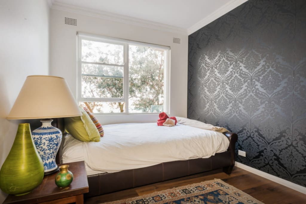 The bedroom looks straight out over Bondi beach ...full morning sunrise