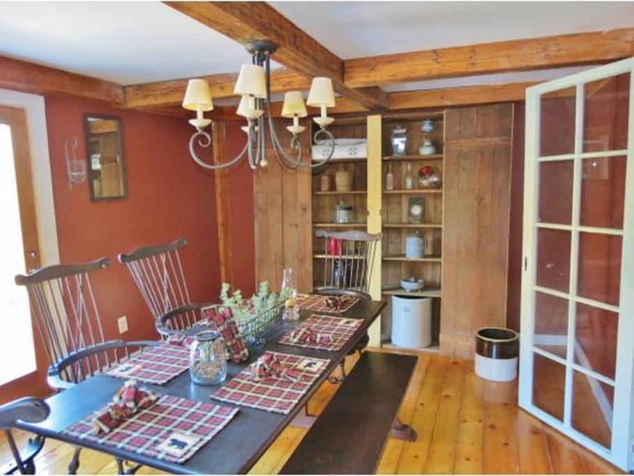 Cozy Vermont style country home. This dining room is great for entertaining. There's also a sliding door entrance to the back porch for great views of the green mountains.