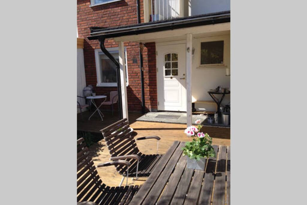 Front entrance with eating area in the morning sun.