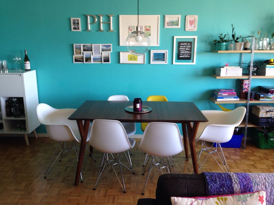 Dining area to seat six with contemporary chairs and decor