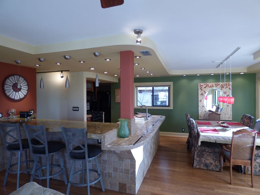 Kitchen (with breakfast bar) and dining area.
