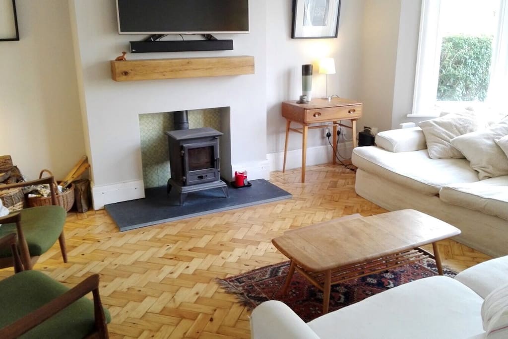 Stylish sitting room with wood burner.