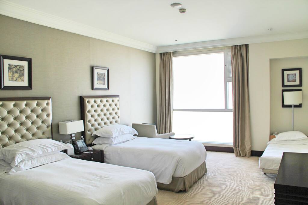 The studio has two large single beds and one small single bed