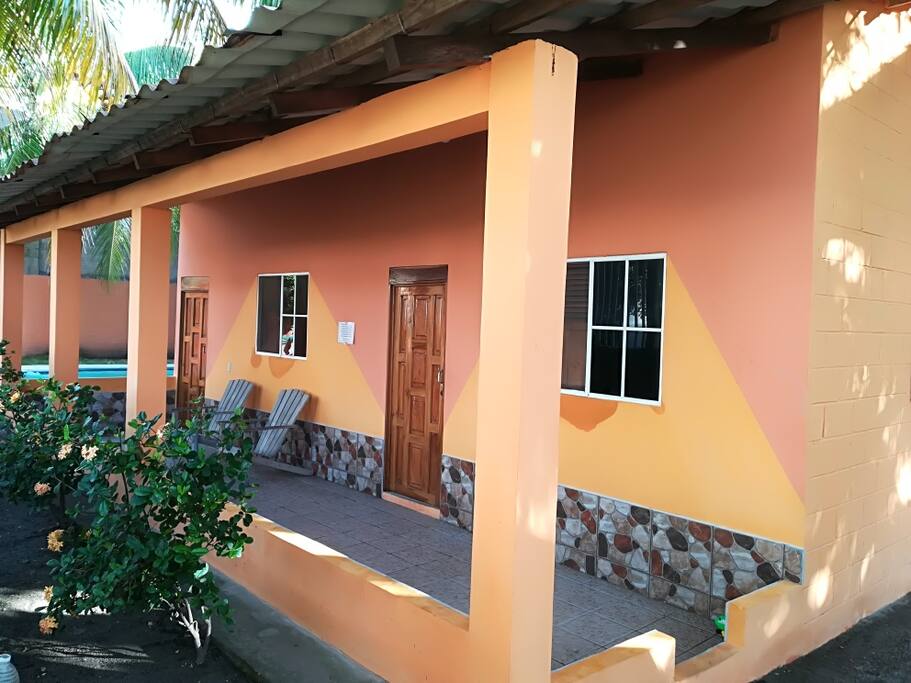 A second cottage has two bedrooms, with three double beds in each.